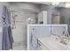 Spacious bathroom featuring a modern glass shower with gray and white subway tile and gray walls at 407 Westchester Dr, Altamonte Springs, FL 32701