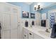 Charming bathroom featuring double sinks, updated fixtures, and blue accents, creating a calming and stylish space at 407 Westchester Dr, Altamonte Springs, FL 32701