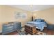 Serene bedroom with soft lighting, a large window, and wood-look flooring, offering a relaxing retreat at 407 Westchester Dr, Altamonte Springs, FL 32701