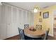 Cozy breakfast nook featuring a round table with four chairs, unique lighting fixture and closet storage at 407 Westchester Dr, Altamonte Springs, FL 32701
