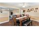 Dining room with a large table, decorative artwork, and an open view to the living room area at 407 Westchester Dr, Altamonte Springs, FL 32701