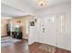 Inviting entryway with a decorative door, hardwood floors, and an open view to the adjacent living area at 407 Westchester Dr, Altamonte Springs, FL 32701
