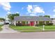 Inviting brick home featuring a manicured lawn and a long driveway at 407 Westchester Dr, Altamonte Springs, FL 32701