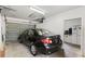 Single car garage showing a black car parked inside at 407 Westchester Dr, Altamonte Springs, FL 32701