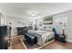 Large primary bedroom featuring a king bed, plenty of closet space, and natural light at 407 Westchester Dr, Altamonte Springs, FL 32701