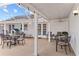 Covered patio featuring string lights, outdoor seating, and a view of the landscaped backyard and pool at 407 Westchester Dr, Altamonte Springs, FL 32701