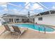 Enclosed pool area with lounge chairs, play area, and covered seating at 407 Westchester Dr, Altamonte Springs, FL 32701