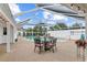 Enclosed pool area featuring a beautiful pool, spa and outdoor seating with a view of the landscaped backyard at 407 Westchester Dr, Altamonte Springs, FL 32701
