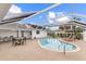 Sparkling pool area with screened enclosure, lounge chairs and outdoor dining space at 407 Westchester Dr, Altamonte Springs, FL 32701