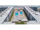 Aerial view showcasing community pools, beach access, and surrounding condo buildings at 4153 S Atlantic Ave # 2120, New Smyrna Beach, FL 32169