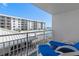 Balcony view of a community pool and beachfront condos on a sunny day at 4153 S Atlantic Ave # 2120, New Smyrna Beach, FL 32169