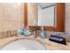 Charming bathroom vanity with granite countertops, a decorative mirror, and convenient sink accessories at 4153 S Atlantic Ave # 2120, New Smyrna Beach, FL 32169