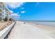 Enjoy the sandy shores of the beach, just steps away from the condos, on a clear day at 4153 S Atlantic Ave # 2120, New Smyrna Beach, FL 32169