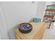 Decorated entryway table, wicker storage, and beach-themed decorations at 4153 S Atlantic Ave # 2120, New Smyrna Beach, FL 32169