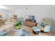 Inviting living room with tile floors, neutral walls, stylish decor, and comfortable seating at 4153 S Atlantic Ave # 2120, New Smyrna Beach, FL 32169