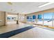 Bright lobby features tile flooring, and floor-to-ceiling windows with views of the inviting outdoor pool area at 4153 S Atlantic Ave # 2120, New Smyrna Beach, FL 32169