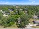 Aerial view of the house surrounded by trees at 500 W Oakland Ave, Oakland, FL 34760