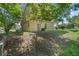 The side of the two-story house with the backyard at 500 W Oakland Ave, Oakland, FL 34760