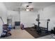 Unfinished basement features exercise area and water heater at 500 W Oakland Ave, Oakland, FL 34760