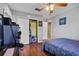 Bedroom with wood floor and closet at 500 W Oakland Ave, Oakland, FL 34760