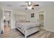 Serene bedroom with hardwood floors, neutral decor, and plenty of natural light at 500 W Oakland Ave, Oakland, FL 34760