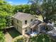 Two-story house with stone accents and a well maintained yard at 500 W Oakland Ave, Oakland, FL 34760