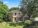 Two-story house with stone accents and a well maintained yard at 500 W Oakland Ave, Oakland, FL 34760