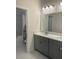This is a bathroom featuring double sinks, lots of counter space, and a bath tub at 605 Big Pine Ave, Minneola, FL 34715