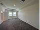 This primary bedroom has new carpet, lots of light, and a tray ceiling at 605 Big Pine Ave, Minneola, FL 34715