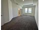 This primary bedroom has new carpet, lots of light, and a tray ceiling at 605 Big Pine Ave, Minneola, FL 34715