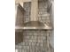 This kitchen features a modern stainless steel range hood at 605 Big Pine Ave, Minneola, FL 34715
