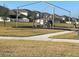 A community playground on a grassy lot with shade at 605 Big Pine Ave, Minneola, FL 34715