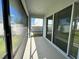 Screened-in porch featuring sliding glass doors, neutral floors and walls, and a lovely view at 605 Big Pine Ave, Minneola, FL 34715