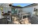 Outdoor kitchen on the backyard deck that offers a perfect setup for cooking and dining al fresco at 6428 Lynn Rd, Orlando, FL 32810