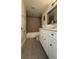 Bathroom features white vanity, vessel sink, and tiled shower with great storage at 6428 Lynn Rd, Orlando, FL 32810