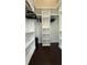 Walk-in closet with custom shelving and hanging rods to maximize storage space at 6428 Lynn Rd, Orlando, FL 32810
