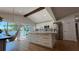 Spacious kitchen featuring an island with seating, stainless steel appliances, and plenty of cabinet space at 6428 Lynn Rd, Orlando, FL 32810