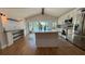 Stylish kitchen with modern appliances, including a large island with views of the lake at 6428 Lynn Rd, Orlando, FL 32810
