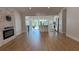 Open-concept living space with island, fireplace, and abundant natural light offers relaxation and comfort at 6428 Lynn Rd, Orlando, FL 32810