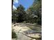 Inground pool with ladder in backyard needing repair and cleaning at 6616 Blanche Ct, Orlando, FL 32818