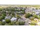 Scenic aerial view of the neighborhood showcasing lush greenery and diverse housing options in a serene setting at 765 Coach Light Dr, Casselberry, FL 32730
