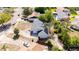 An aerial view of a one-story home with a swimming pool and a driveway at 765 Coach Light Dr, Casselberry, FL 32730