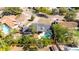 An aerial view of a home with a fenced yard and a swimming pool and a spa at 765 Coach Light Dr, Casselberry, FL 32730