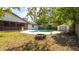 Backyard showcasing a swimming pool and a fire pit at 765 Coach Light Dr, Casselberry, FL 32730