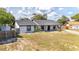 Exterior view of single-story home featuring landscaping and mature trees at 765 Coach Light Dr, Casselberry, FL 32730