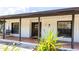 Charming front porch with a swing, brick flooring, and a stylish front door at 765 Coach Light Dr, Casselberry, FL 32730