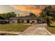 Charming single-story home with a well-manicured lawn and beautiful, mature landscaping at 765 Coach Light Dr, Casselberry, FL 32730