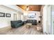 Cozy living room with a brick fireplace, wood ceiling, and two leather couches at 765 Coach Light Dr, Casselberry, FL 32730