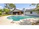 Backyard featuring a kidney shaped swimming pool and screened porch at 765 Coach Light Dr, Casselberry, FL 32730