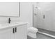Modern bathroom with white vanity, glass shower, and a toilet at 7706 Ficquette Rd, Windermere, FL 34786
